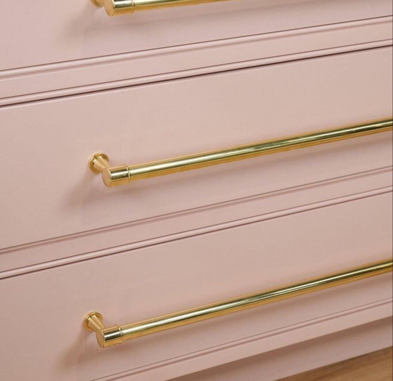 Blush dresser with brass pulls