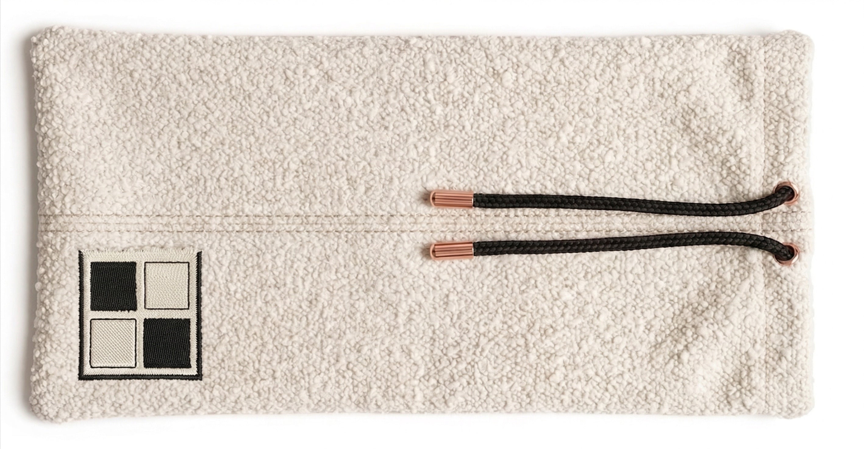 Ivory bouclé rack pouch with rose-gold drawstring tips and embroidered Mise en Mahjong patch.